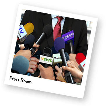 words "Press Room" shows body of person in front of a lot of microphones.