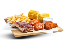 BBQ Ribs And Wings combo with corn and fries and dipping sauce