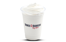 Vanilla Shake in clear logo cup with whipped cream on top